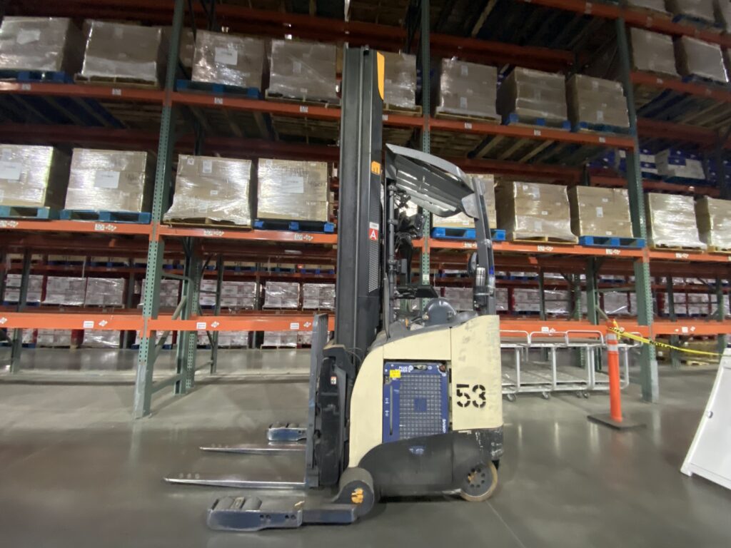 Picture of a hydrogen fuel cell powered forklift in use at a Walmart facility.