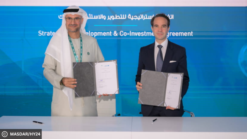 Mohamed Jameel Al Ramahi, CEO of Masdar and Amir Sharifi, Chief Investment Officer of Hy24 holding the framework agreement at the COP28 conference in Dubai.